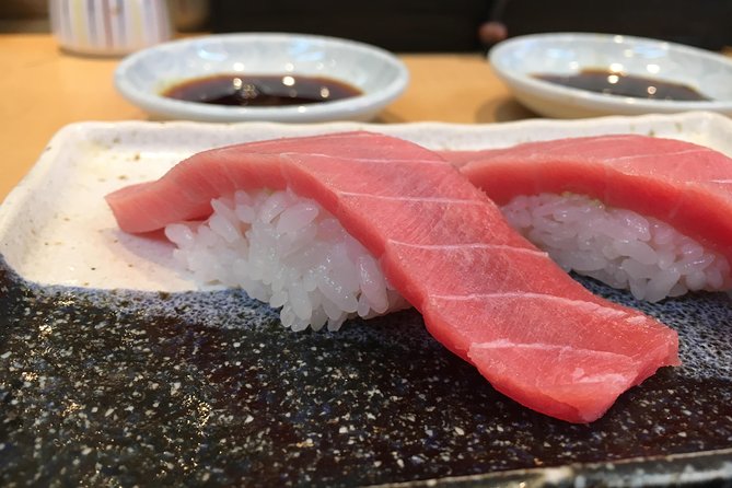 Eat, Drink & Cycle: Osaka Foodie Bike Tour - Final sushi shop and kushikatsu skewers on the side