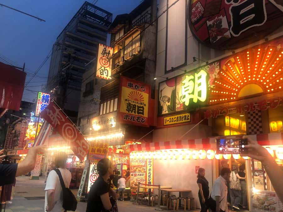 Hungry Osaka Street Food Tour: 15 Dishes & 3 Drinks - Shinsekai after dark: where the tour really starts