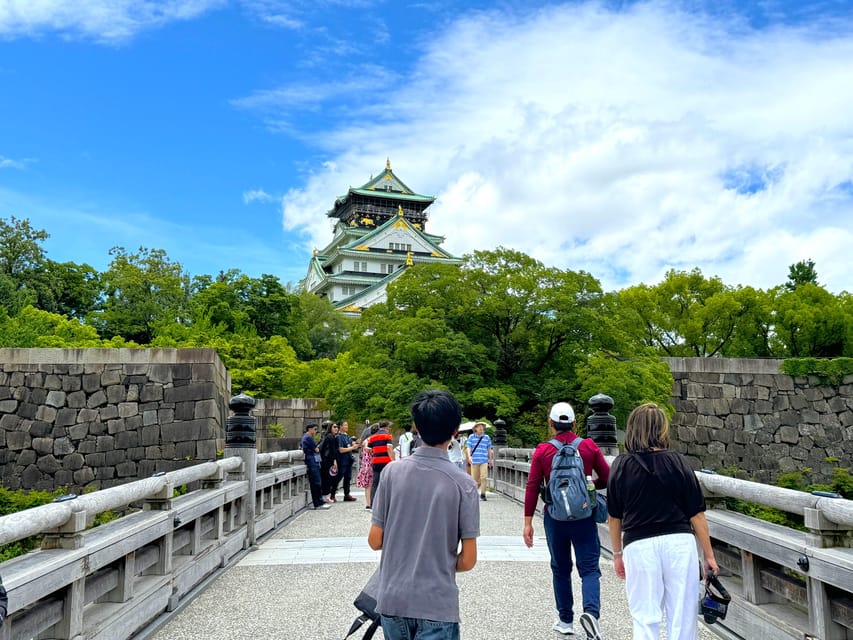 Osaka: 1-Day Guided Tour - Sky Bldg, Castle, Namba Shinsekai - Meeting at JR Osaka Station, finding the yellow sign