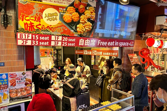 Osaka Delights: Traditional Japanese Food Tour - Kuromon Market: Wanaka takoyaki and the Osaka kitchen feel