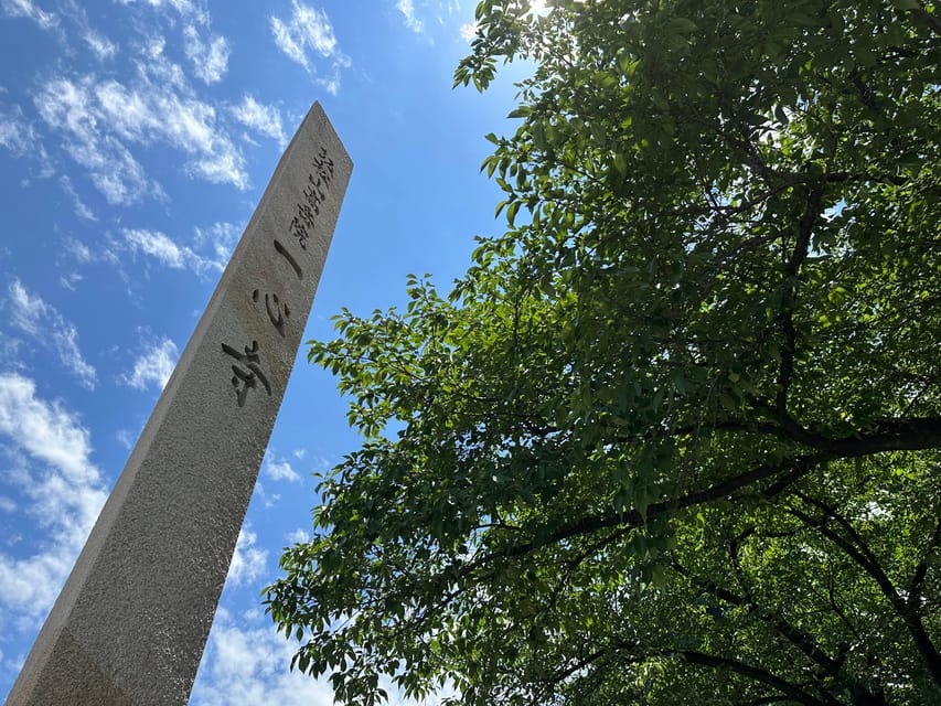 Osaka: Japan’s Oldest Temple & Bone Buddha Walking Tour - Shitennoji Temple: Four Heavenly Kings, symmetry, and the story behind the oldest roots