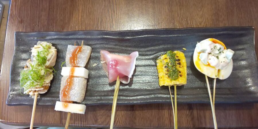Osaka: Shinsekai Food Tour with 13-15 Dishes at 5 Eateries - Portion expectations: 13 dishes in 3 hours feels full, in a good way